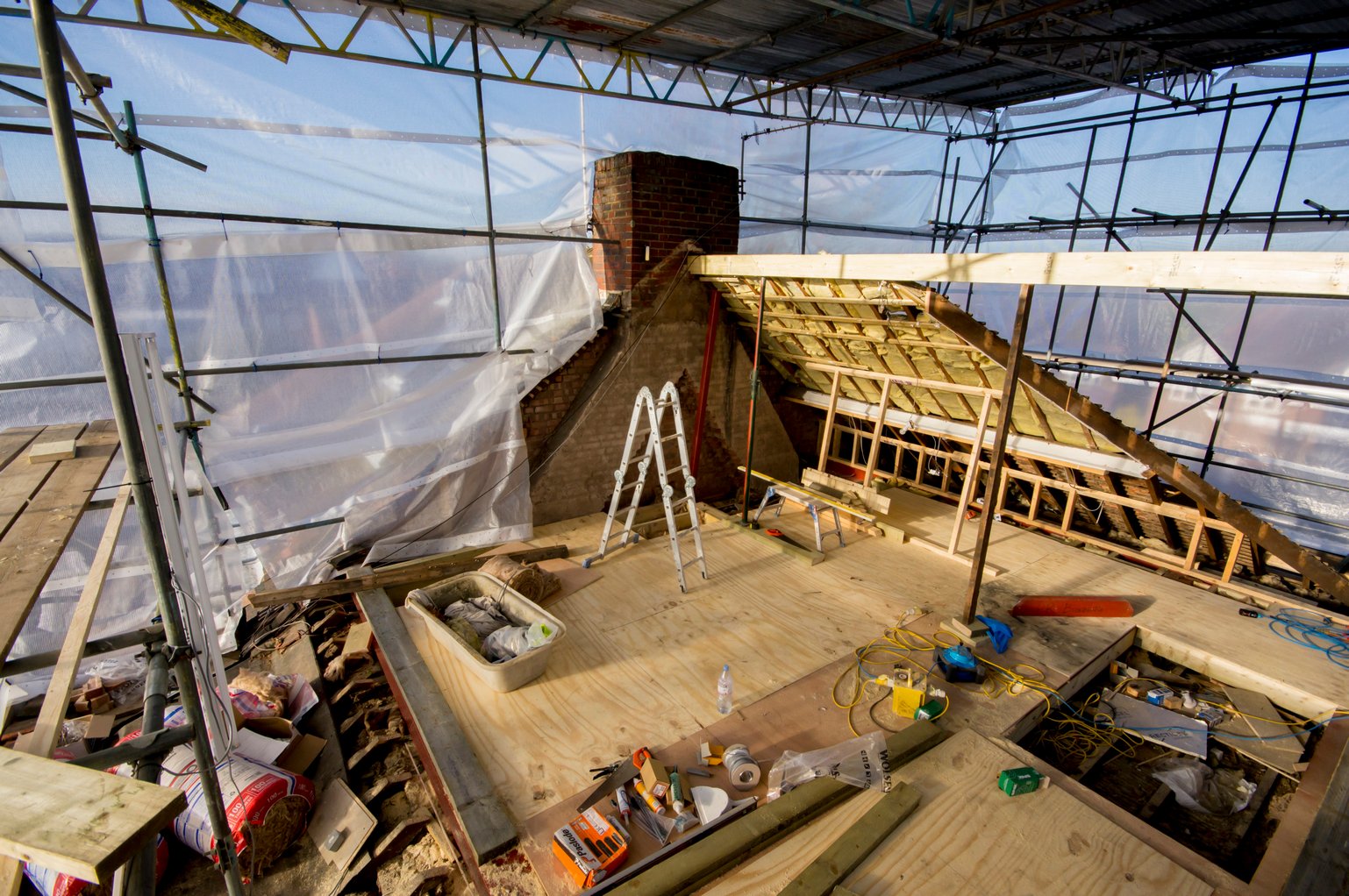 Loft conversion construction site with scaffolding