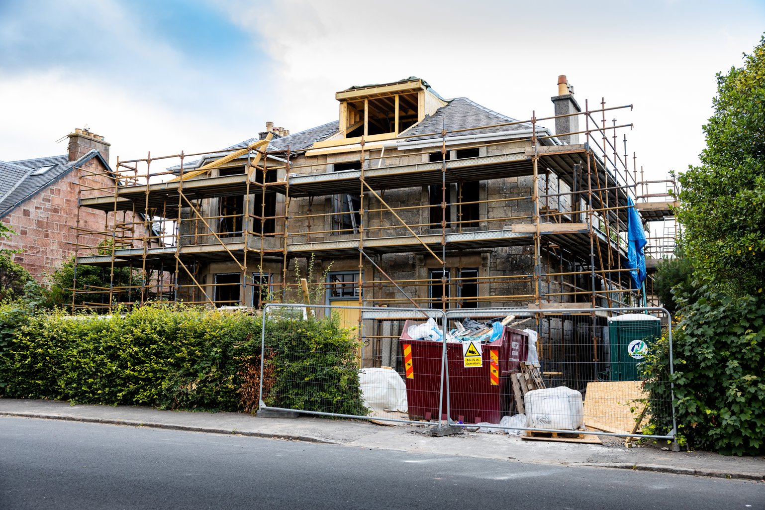 House exterior with scaffolding for loft conversion
